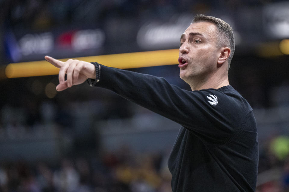 Toronto Raptors head coach Darko Rajakovic gestures during the first half of an NBA basketball game against the Indiana Pacers in Indianapolis, Monday, Feb. 26, 2024. (AP Photo/Doug McSchooler)