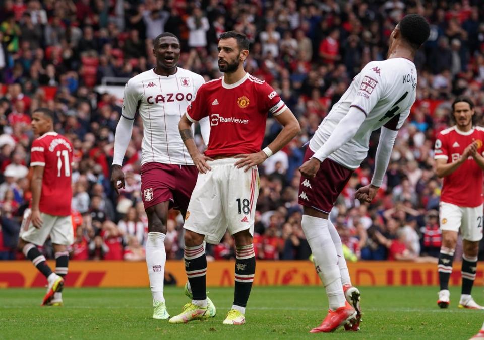 Manchester United’s Bruno Fernandes (centre) reacts to his missed penalty against Aston Villa (Martin Rickett/PA) (PA Wire)