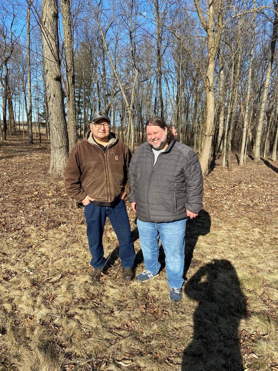 Archaeologist Kurt Sampson (right) and tribal historic preservation officer for the Ho-Chunk Nation Bill Quackenbush (left) stand at an ancient Indigenous mound site in Wisconsin.