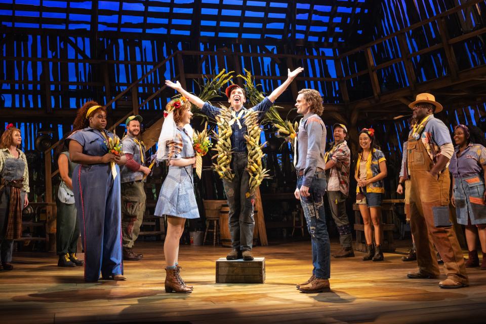 Characters 'Maizy' (Caroline Innerbichler)and 'Beau' (Andrew Durand) meet at the barn altar in new Broadway musical 'Shucked,' which opened April 4.
