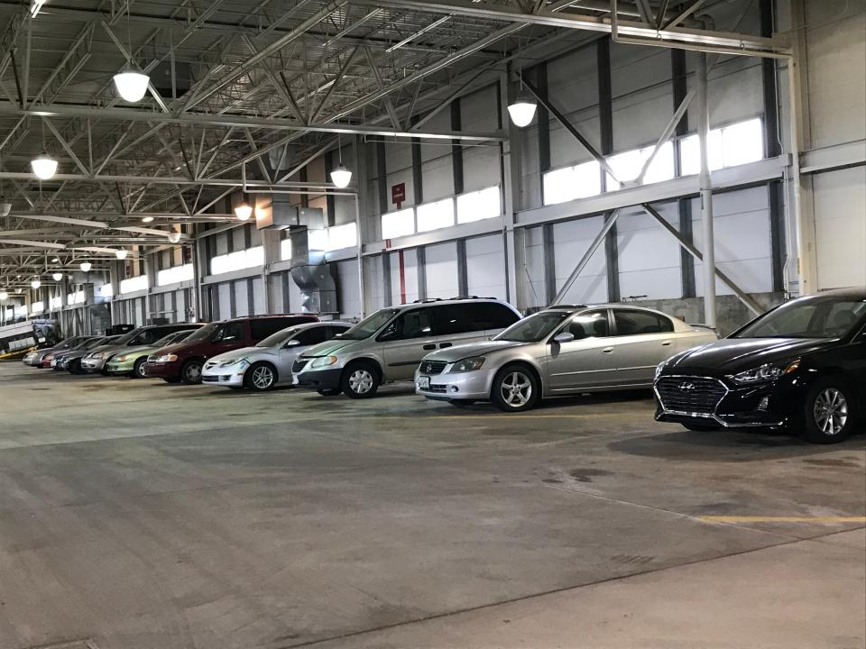 Ten cars join a dozen large trucks on the auction block for objects left behind at Pittsburgh International Airport.