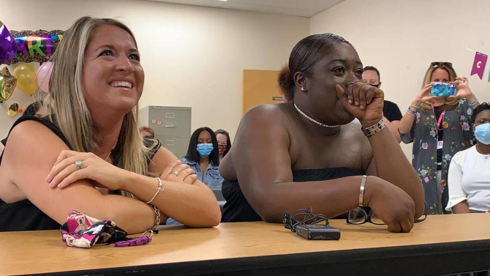 Leah Paskalides, left, and Monyay Paskalides listen to a judge pronouncing them legal mother and daughter in an adult adoption at Safe Children’s Coalition in Bradenton, Florida, on April 27, 2021.