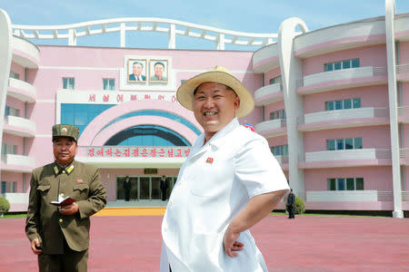 FILE PHOTO: North Korean leader Kim Jong Un provides field guidance to the Wonsan Baby Home and Orphanage in the run-up to a ceremony for their completion, in this undated photo released by North Korea's Korean Central News Agency (KCNA) June 2, 2015. KCNA via Reuters/File Photo