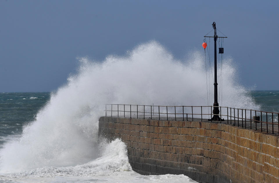 Large waves hit the harbour at Porthleven, Britain, August 10, 2019. REUTERS/Toby Melville.