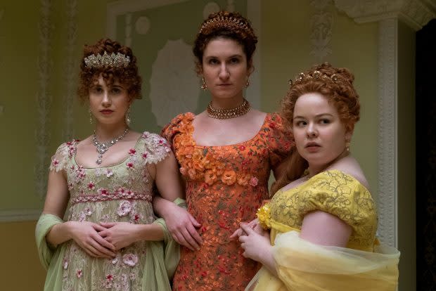 Bessie Carter as Prudence Featherington (center) with Harriet Cains as Philipa Featherington (left) and Nicola Coughlan as Penelope Featherington (right) in "Bridgerton" on Netflix
