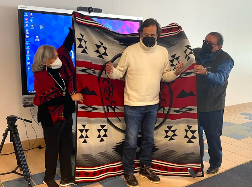 Provost Colleen Bowman and Vice President of Operations Jason Arviso presented Governor Richardson with a warrior’s blanket designed by NTU to thank him for his commitment to Navajo people and their university in January 2022. (Photo/Valerie Taliman)