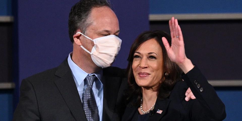 US Democratic vice presidential nominee and Senator from California, Kamala Harris (R) and husband Doug Emhoff stand onstage after the vice presidential debate in Kingsbury Hall at the University of Utah on October 7, 2020, in Salt Lake City, Utah. (Photo by Robyn Beck / AFP) (Photo by ROBYN BECK/AFP via Getty Images)