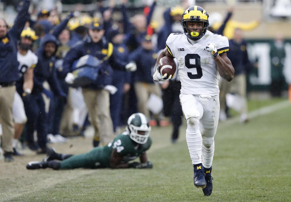 Michigan wide receiver Donovan Peoples-Jones (9) runs for a 79-yard touchdown run during the second half of an NCAA college football game against Michigan State, Saturday, Oct. 20, 2018, in East Lansing, Mich. (AP Photo/Carlos Osorio)