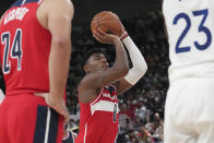 Washington Wizards' Rui Hachimura, center, shoots a freethrow during his preseason NBA basketball game against Golden State Warriors, Friday, Sept. 30, 2022, at Saitama Super Arena, in Saitama, north of Tokyo. (AP Photo/Eugene Hoshiko)