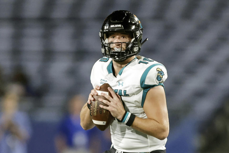 FILE - Coastal Carolina quarterback Grayson McCall (10) drops back to pass during the first half of an NCAA football game against Georgia State on Thursday, Sept. 22, 2022, in Atlanta. McCall will miss three to six weeks with a foot injury sustained a week ago in a win over Appalachian State. The school announced McCall's status Wednesday, Nov. 9. The injury's recovery timeline means that McCall's availability for a potential Sun Belt Conference championship game on Dec. 3 is in question. (AP Photo/Stew Milne, File)