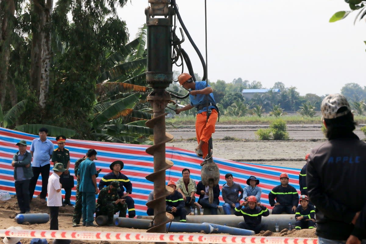 File photo: Rescuers who were attempting to free Vietnamese boy trapped in a shaft (EPA)