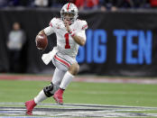 FILE - In this Dec. 7, 2019, file photo, Ohio State quarterback Justin Fields (1) runs with the ball against Wisconsin during the first half of the Big Ten championship NCAA college football game, in Indianapolis. After the Power Five conference commissioners met Sunday, Aug. 9, 2020, to discuss mounting concern about whether a college football season can be played in a pandemic, players took to social media to urge leaders to let them play. (AP Photo/Michael Conroy, File)