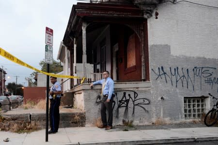 Police stand near the scene during an active shooter situation in Philadelphia