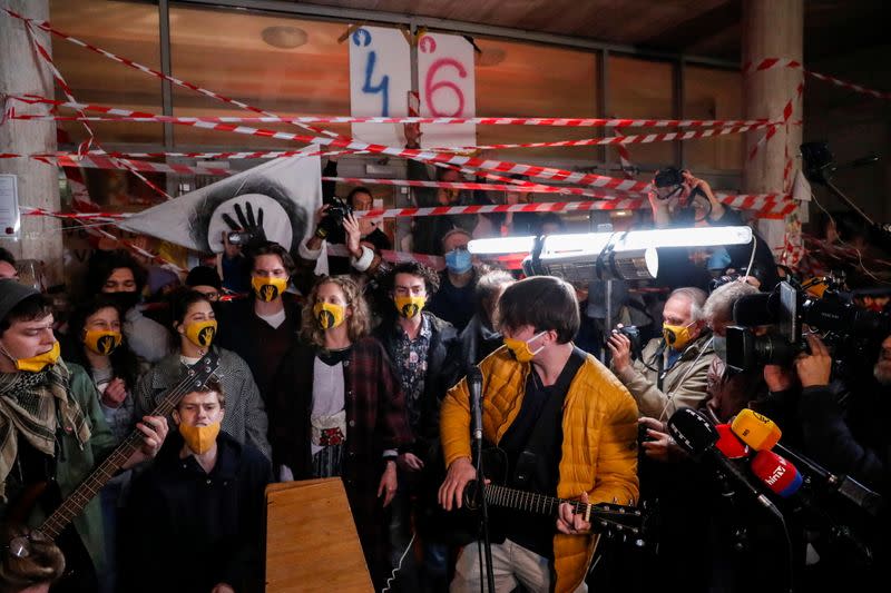 Students hold a news conference in front of the University of Theatre and Film Arts in Budapest