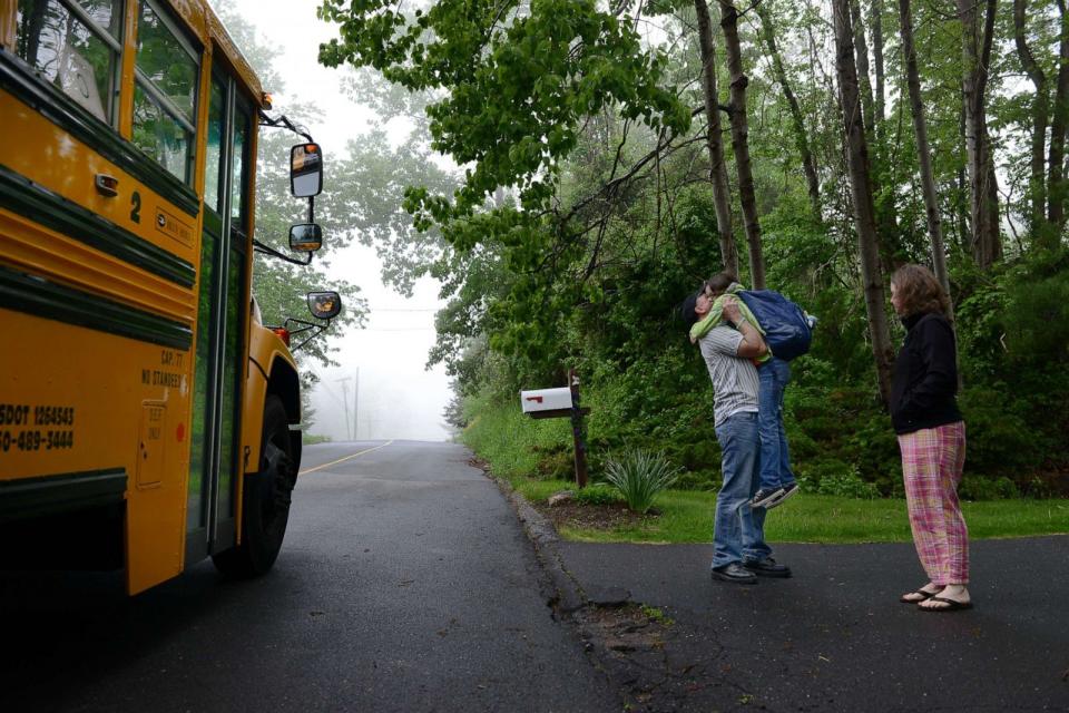 PHOTO: Mark and Jackie Barden hug their daughter Natalie before she goes to school, May 23, 2013, in Newtown, Conn.   (Linda Davidson/The Washington Post via Getty Images)