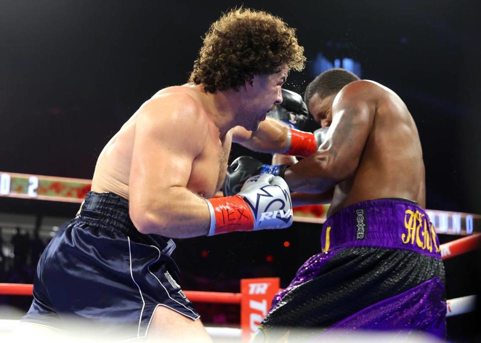 Richard Torrez Jr. of Tulare lands a punch against Tyrell Anthony Herndon on Saturday, Oct. 14, 2023.