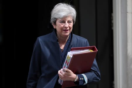 FILE PHOTO: Britain's Prime Minister Theresa May leaves Downing Street in London
