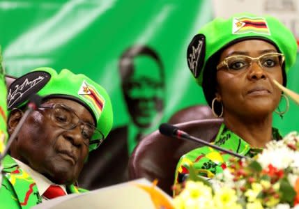 Zimbabwean President Robert Mugabe and his wife Grace attend a meeting of his ruling ZANU PF party's youth league in Harare, Zimbabwe, October 7, 2017. REUTERS/Philimon Bulawayo