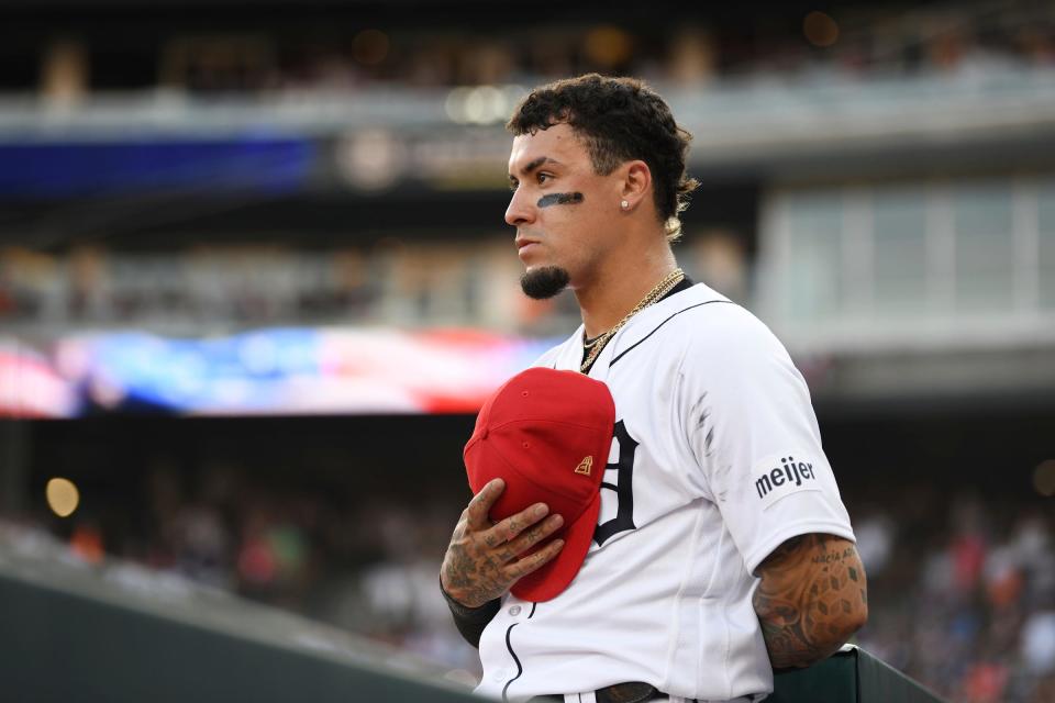 Tigers shortstop Javier Baez stands at attention outside the dugout as "God Bless America" is played in the middle of the seventh inning of the Tigers' 1-0 loss in 10 innings to the Athletics on Tuesday, July 4, 2023, at Comerica Park.
