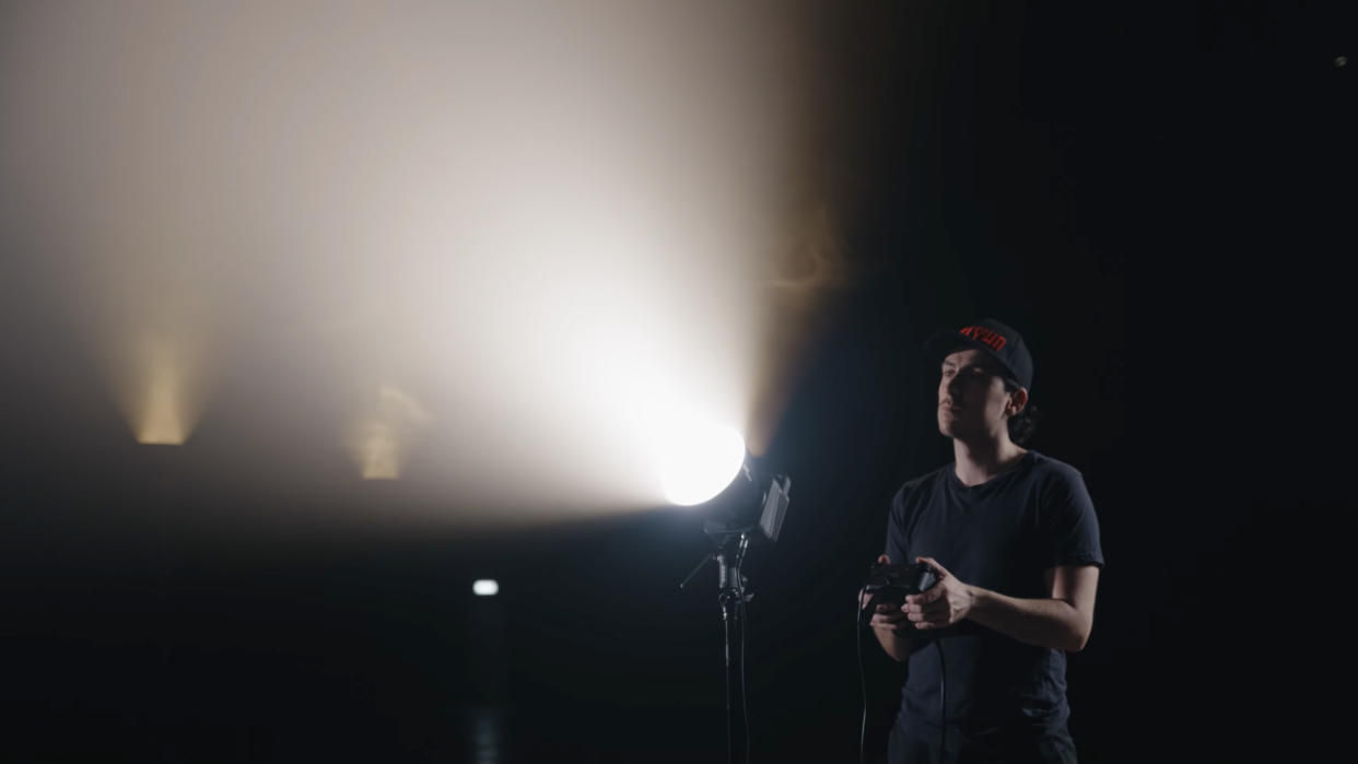  A Zhiyun Molus G300 COB light being used by a lighting technician. 