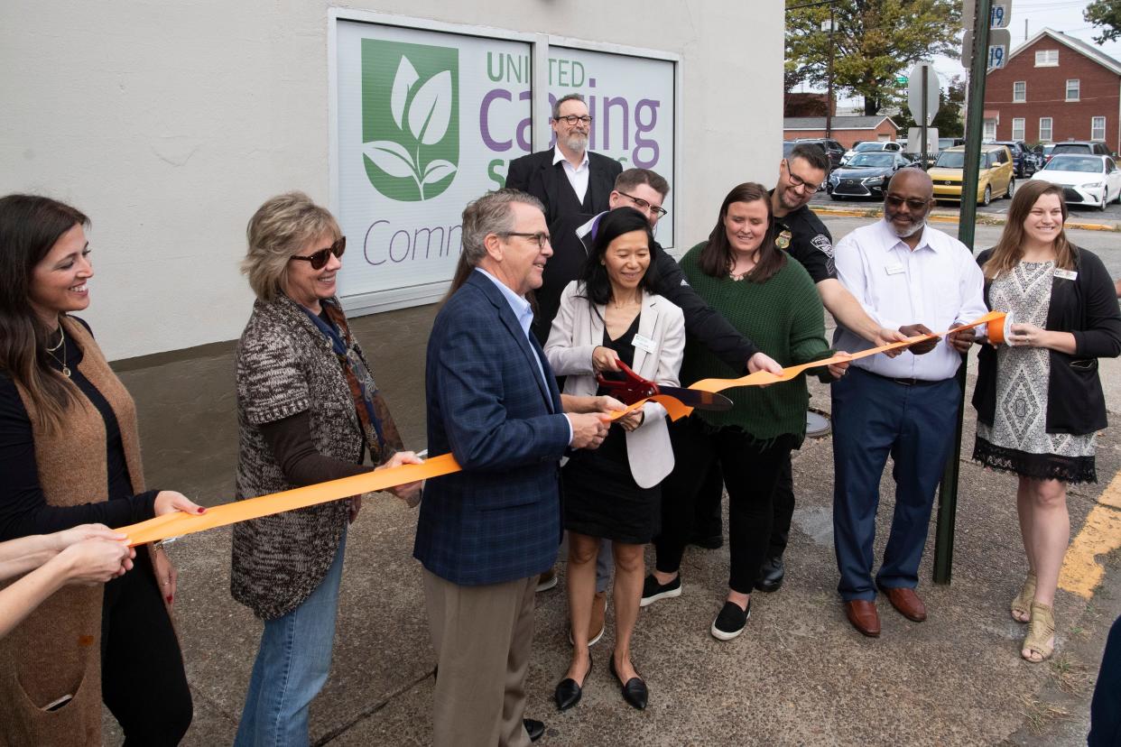 United Caring Services executive director Va Cun cuts the ribbon on the new four-bed Evansville Diversion Center in Downtown Evansville, Ind., Wednesday, Oct. 25, 2023.