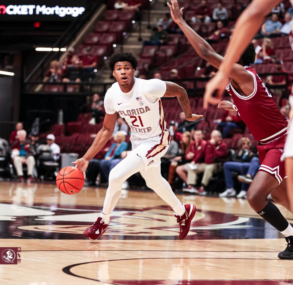 Florida State guard Cam'ron Fletcher, a former UK player, dribbles in a November 2022 game.