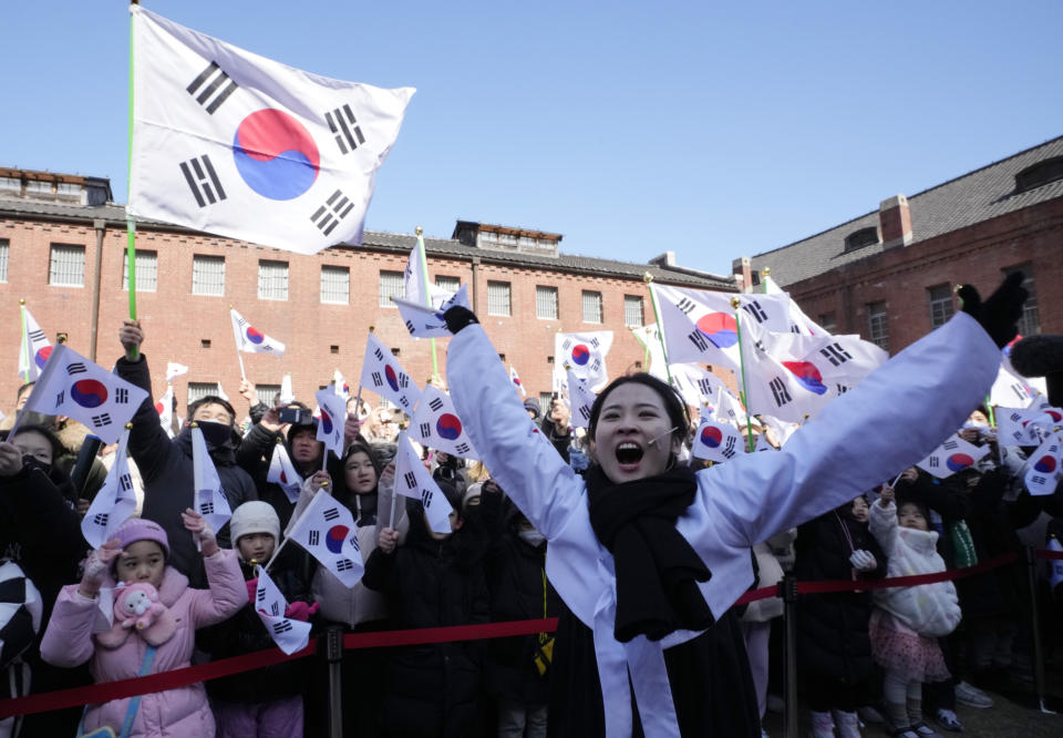 South Koreans cheer for the country during a ceremony to celebrate the March First Independence Movement Day, the anniversary of the 1919 uprising against Japanese colonial rule, in Seoul, South Korea, Friday, March 1, 2024. (AP Photo/Ahn Young-joon)