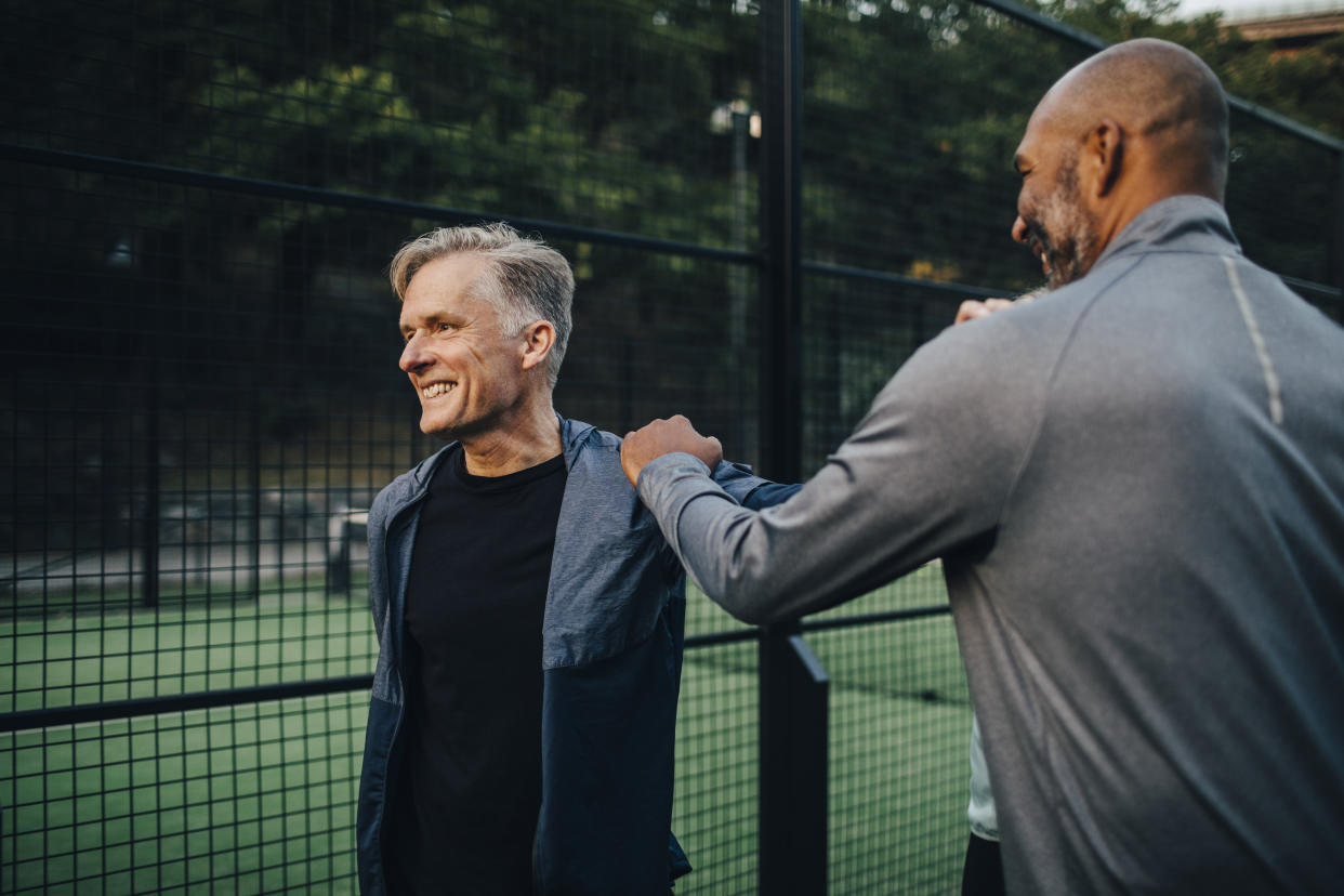 men warming up on sports pitch