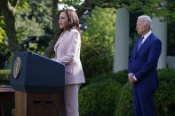 President Joe Biden listens as Vice President Kamala Harris speaks before the signing of a bill in the Rose Garden of the White House, in Washington, Thursday, Aug. 5, 2021, that awards Congressional gold medals to law enforcement officers that protected members of Congress at the Capitol during the Jan. 6 riot. (AP Photo/Evan Vucci)