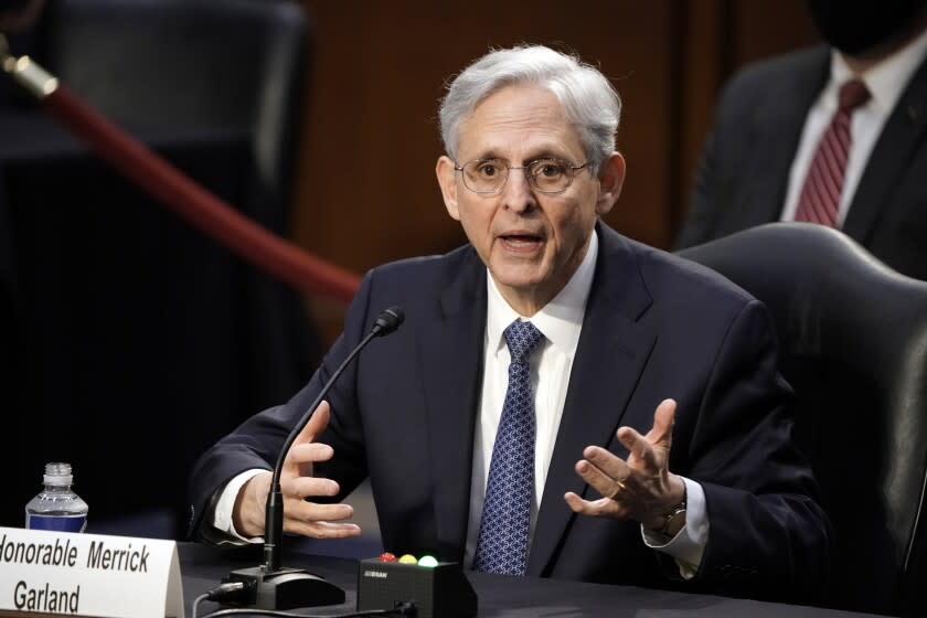 Judge Merrick Garland, President Joe Biden's pick to be attorney general, answers questions from Sen. John Kennedy, R-La., as he appears before the Senate Judiciary Committee for his confirmation hearing, on Capitol Hill in Washington, Monday, Feb. 22, 2021. (AP Photo/J. Scott Applewhite)