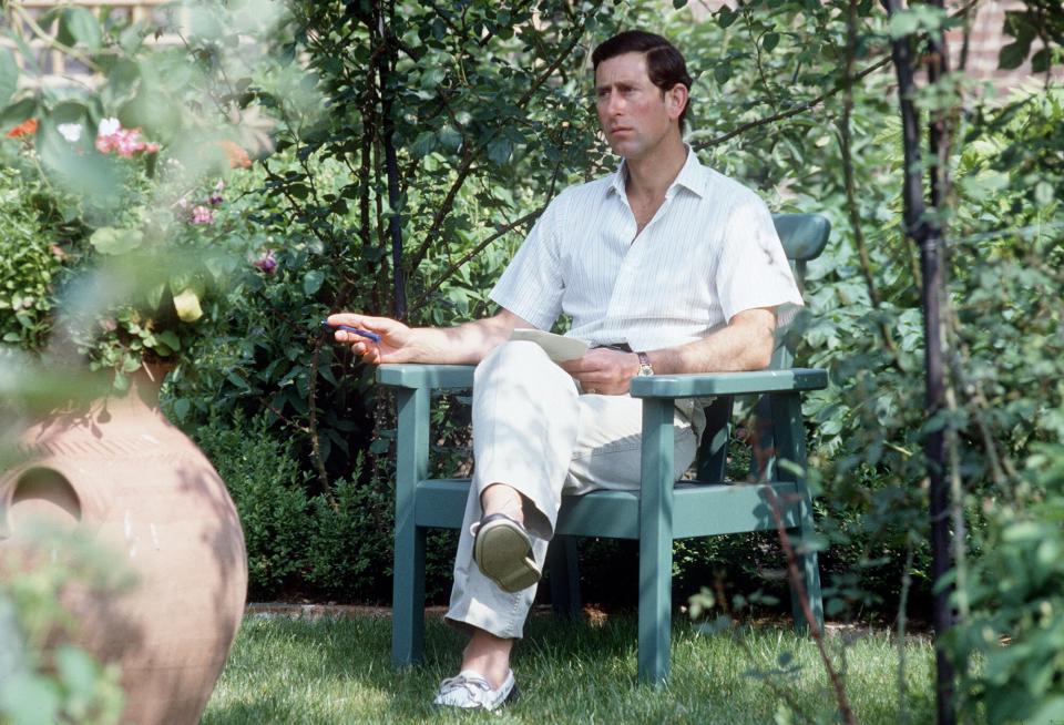 Prince Charles sitting in his garden at Highgrove