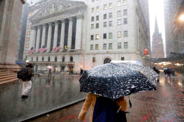 Snow falls onto an umbrella in NYC in April of 2018.