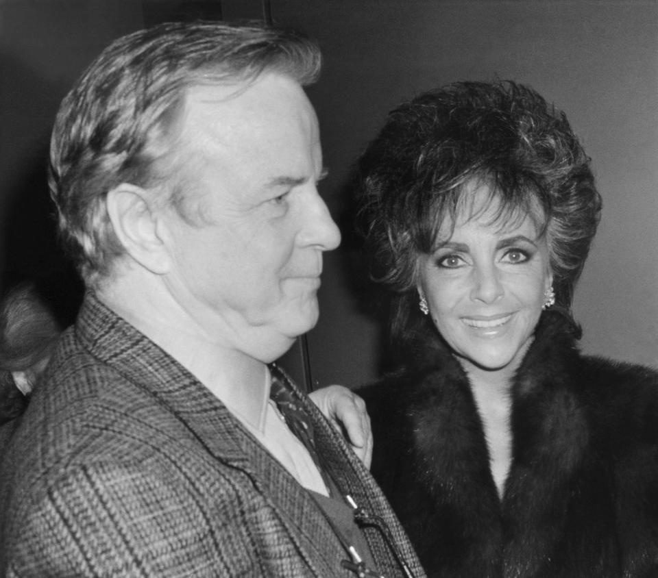 FILE - In this April 10, 1987 file photo,Franco Zefferelli, producer and set designer of the Puccini opera "Turandot,", escorts Liz Taylor to her limousine after the performance. Italian director Franco Zeffirelli, famed for operas, films and television, has died in Rome at the age of 96. Zefffirelli's son Luciano said his father died at home at noon on Saturday. (AP Photo/Frankie Ziths, File)