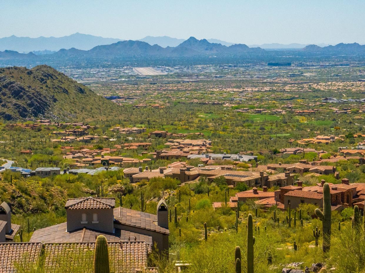 Mega mansions in the desert in Scottsdale with mountains in the background