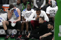 Miami Heat players watch from the bench while trailing the Boston Celtics by more than 30 points during the second half of Game 5 of an NBA basketball first-round playoff series, Wednesday, May 1, 2024, in Boston. (AP Photo/Charles Krupa)