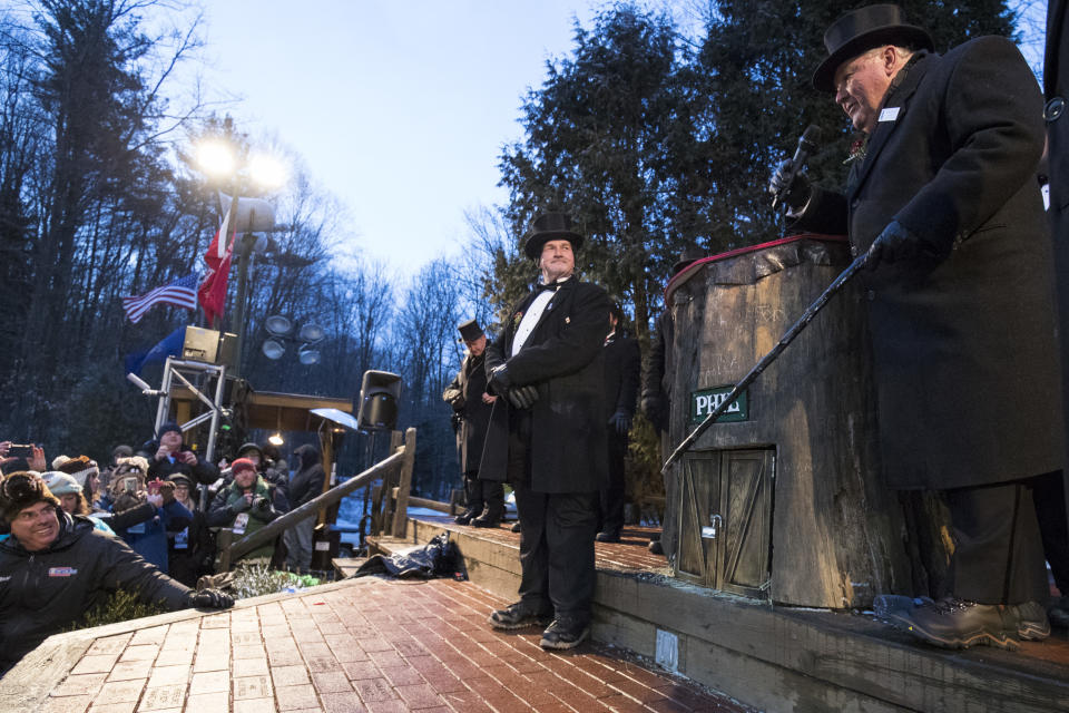 <p>The door on Punxsutawney Phil’s hutch is knocked with a cane to awaken him, Phil saw his shadow and predicted six more weeks of winter on Feb. 2, 2018 in Punxsutawney, Pa. (Photo: Brett Carlsen/Getty Images) </p>