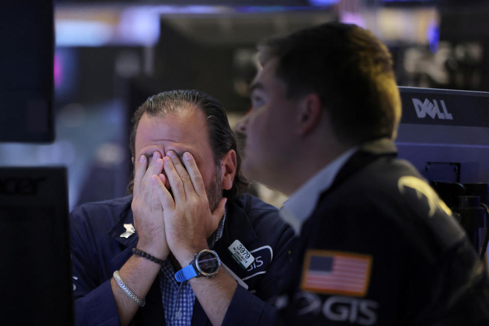 Traders work on the trading floor at the New York Stock Exchange (NYSE) in Manhattan, New York City, U.S., September 13, 2022. REUTERS/Andrew Kelly