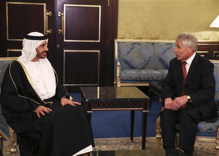 U.S. Secretary of Defense Chuck Hagel (R) meets with United Arab Emirates Minister of Foreign Affairs Sheik Abdullah bin Zayed at the Ritz Carlton Hotel in Manama December 6, 2013. REUTERS/Mark Wilson/Pool