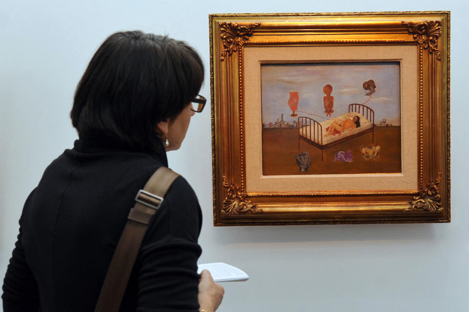 A person looks at the painting “Henry Ford Hospital” during the opening of the Frida Kahlo exhibition in Bozar museum in Brussels on Jan. 16, 2010.<span class="copyright">Johanna Geron—AFP/Getty Images</span>