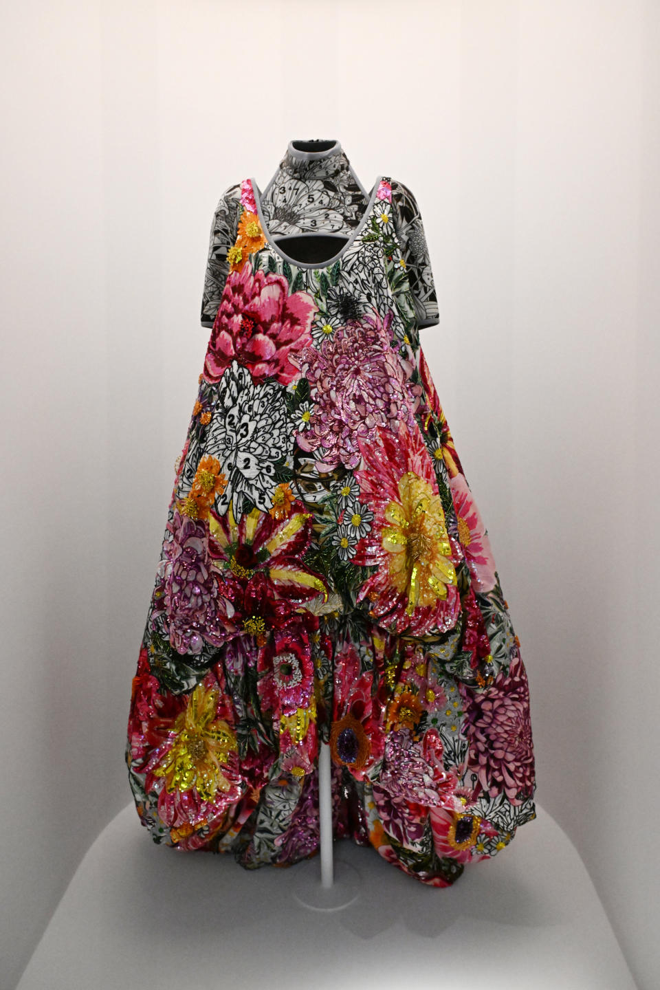 Floral patterned dress on a mannequin, sleeveless with a full skirt