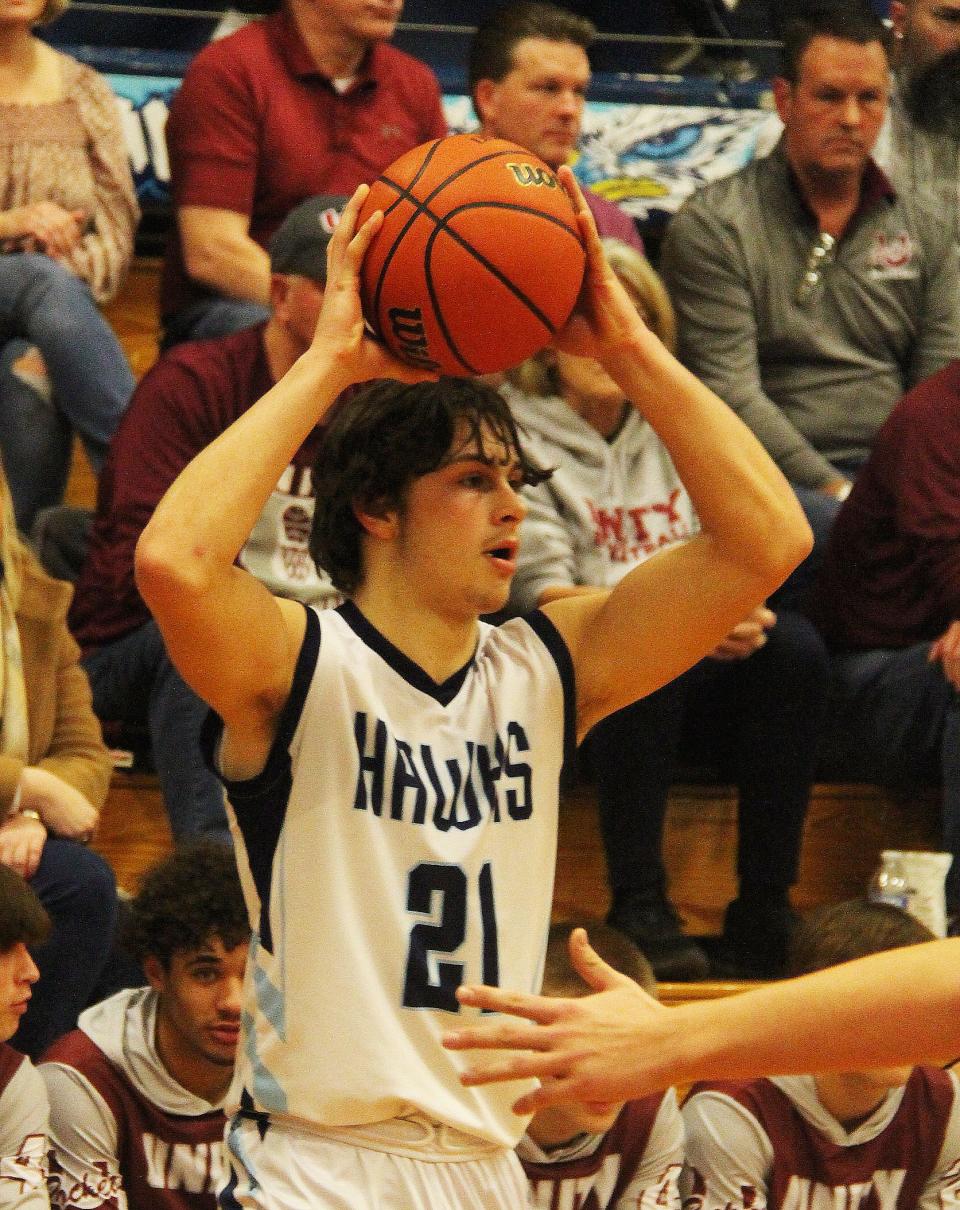 Drew Fehr of Prairie Central looks for an open teammate in Friday's Illini Prairie Conference game with Tolono. Fehr scored 16 points in the Hawks' 45-36 win over the Rockets.