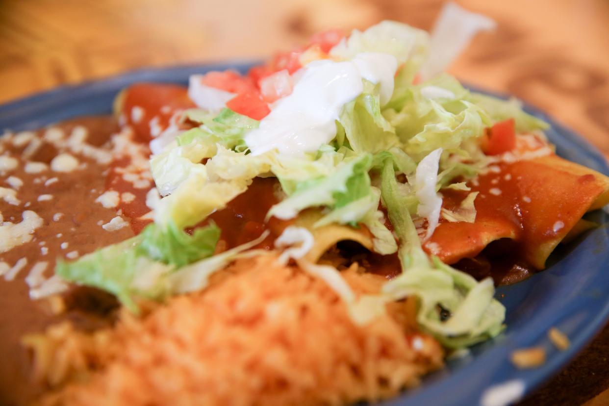 The Chicken Enchiladas Mexicanas with refried beans and rice at Los Agaves Mexican Grill Tuesday, Aug. 13, 2024 in Iowa City, Iowa.