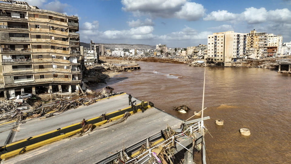 Image: Floodwaters from Mediterranean storm Daniel in Derna, Libya on Sept. 12, 2023.  (Jamal Alkomaty / AP)