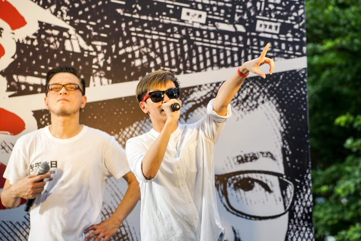 HONG KONG, CHINA - 2019/06/09: Singer Anthony Wong Yiu-ming (Left) and Denise Ho Wan-see (Right) seen at the demonstration against the extradition bill. Hundreds of thousands of demonstrators took to the street of Hong Kong to protest against the extradition bill being put forward by the Hong Kong government which the people of Hong Kong fear it could be used as a political tool by the Beijing central government to arrest and transfer political activists who are against the Chinese government to the mainland. (Photo by Alvin Chan/SOPA Images/LightRocket via Getty Images)