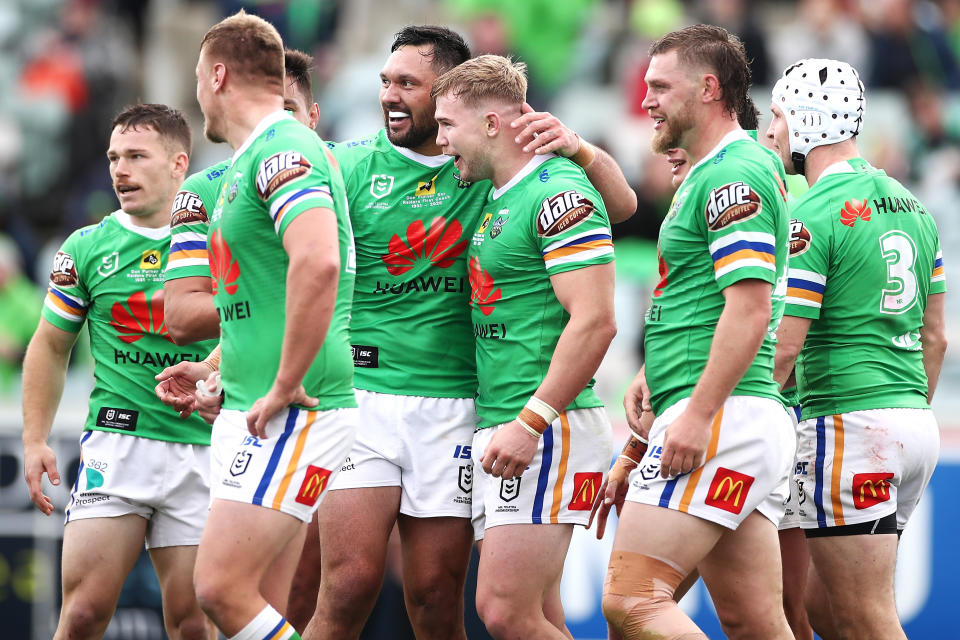 Hudson Young of the Raiders celebrates with his team mates after scoring a try during the round 19 NRL match between the Canberra Raiders and the New Zealand Warriors.