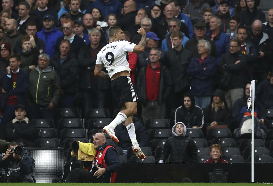 Fulham's Aleksandar Mitrovic celebrates scoring his side's second goal of the game against Burnley, during their English Premier League soccer match at Craven Cottage in London, Sunday Aug. 26, 2018. (John Walton/PA via AP)