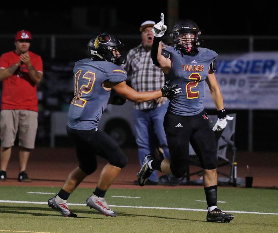 Tulare Union's Sonny Guess celebrates one of his touchdowns against Clovis East during their high school football game in Tulare, Calif., Friday, Sept. 16, 2022.