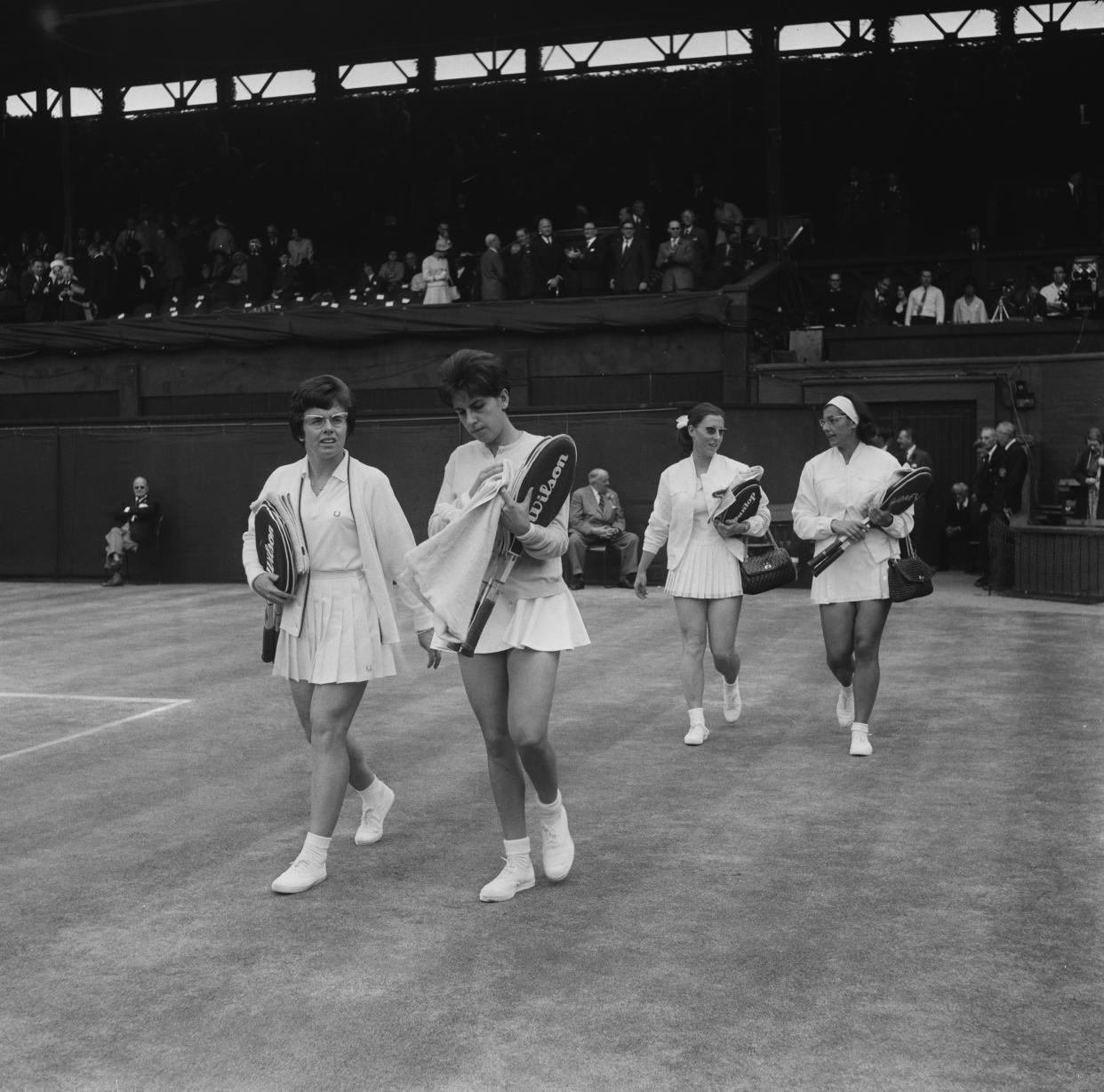 The finalists in the Ladies’ Doubles walk onto the Centre Court at Wimbledon, London, July 3, 1965. From left: Billie Jean Moffitt (later Billie Jean King) of the U.S., Maria Bueno of Brazil, and Françoise Dürr and Janine Lieffrig of France. - Credit: Keystone/Hulton Archive/Getty Images