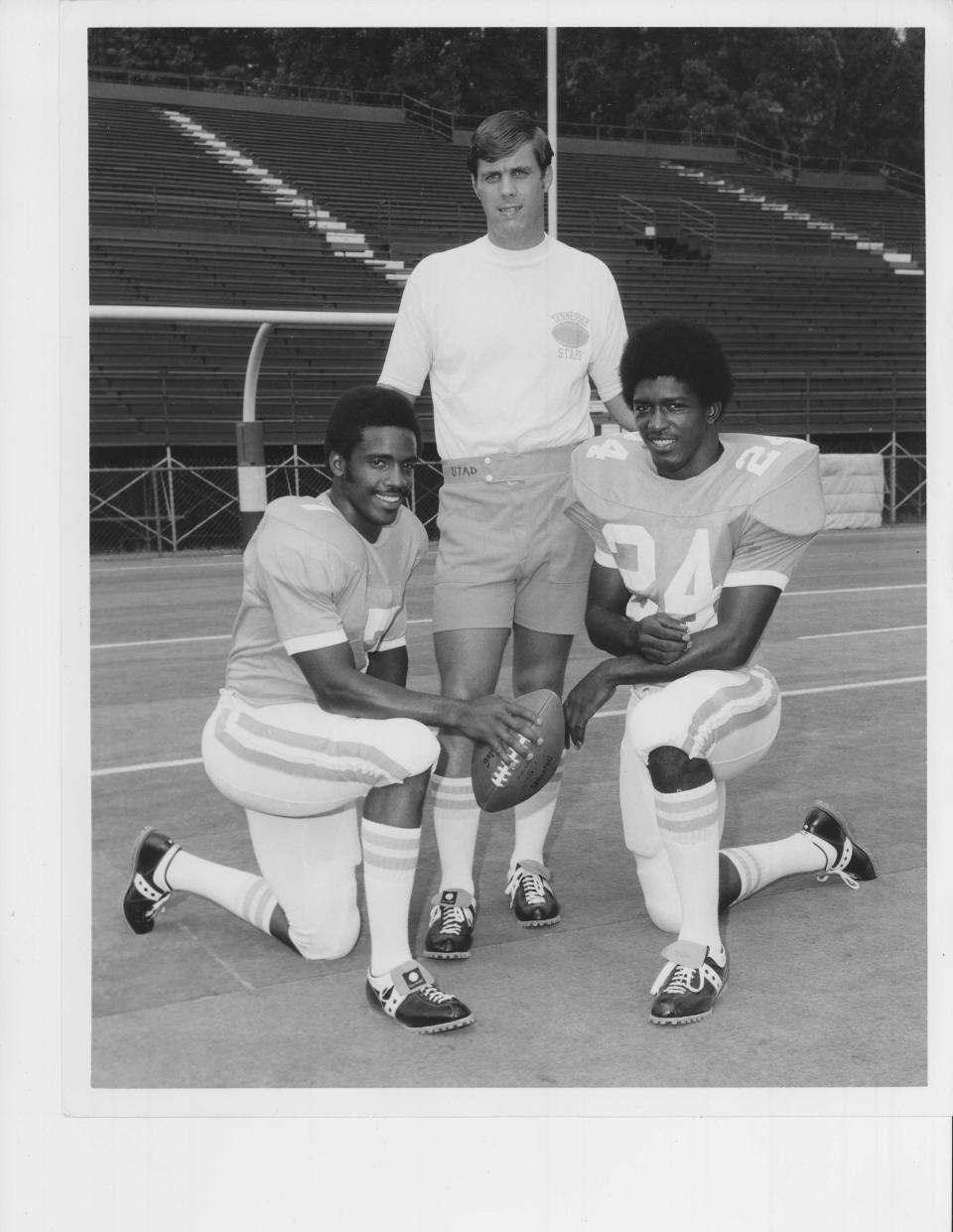 Tennessee coach Bill Battle poses with two of his stars, quarterback Condredge Holloway (7) and tailback Haskel Stanback (24).