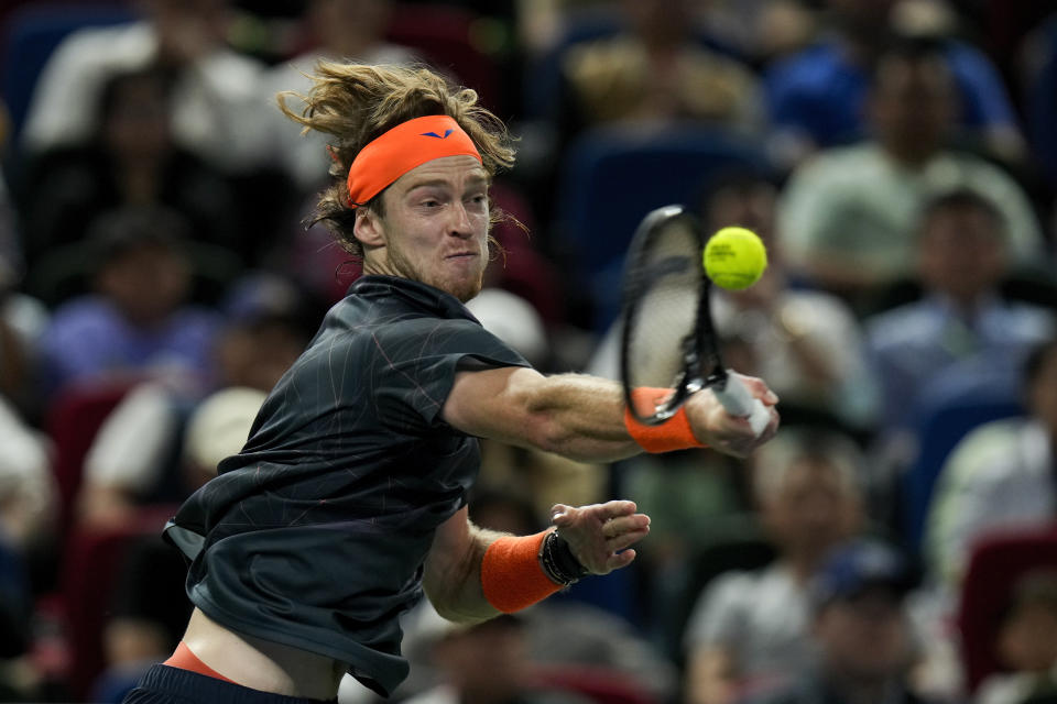 Andrey Rublev of Russia returns a shot to Hubert Hurkacz of Poland during the men's singles final match in the Shanghai Masters tennis tournament at Qizhong Forest Sports City Tennis Center in Shanghai, China, Sunday, Oct. 15, 2023. (AP Photo/Andy Wong)